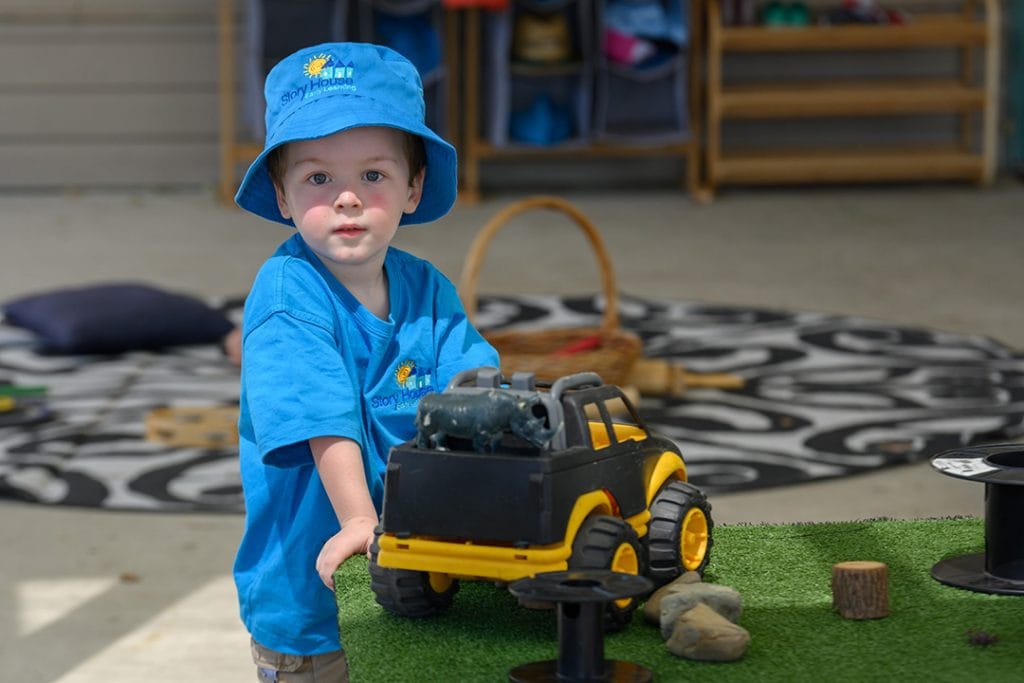 child playing with truck