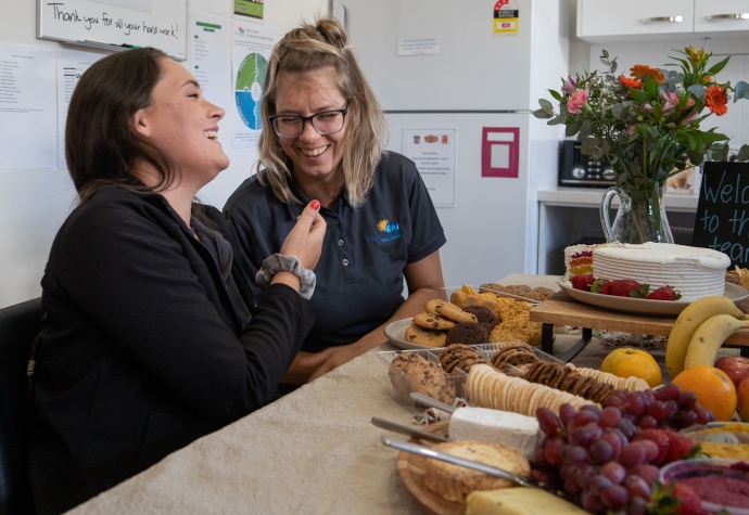 Two educators having morning tea at Story House Chinderah