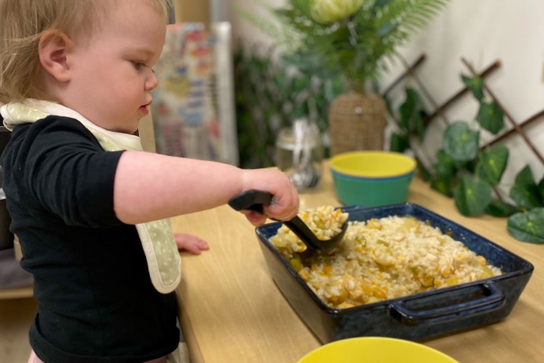 Toddler serving food