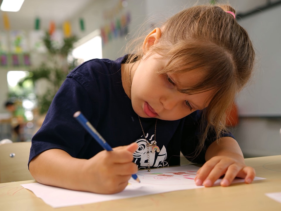 Young girl is drawing at Story House Early Learning Melton