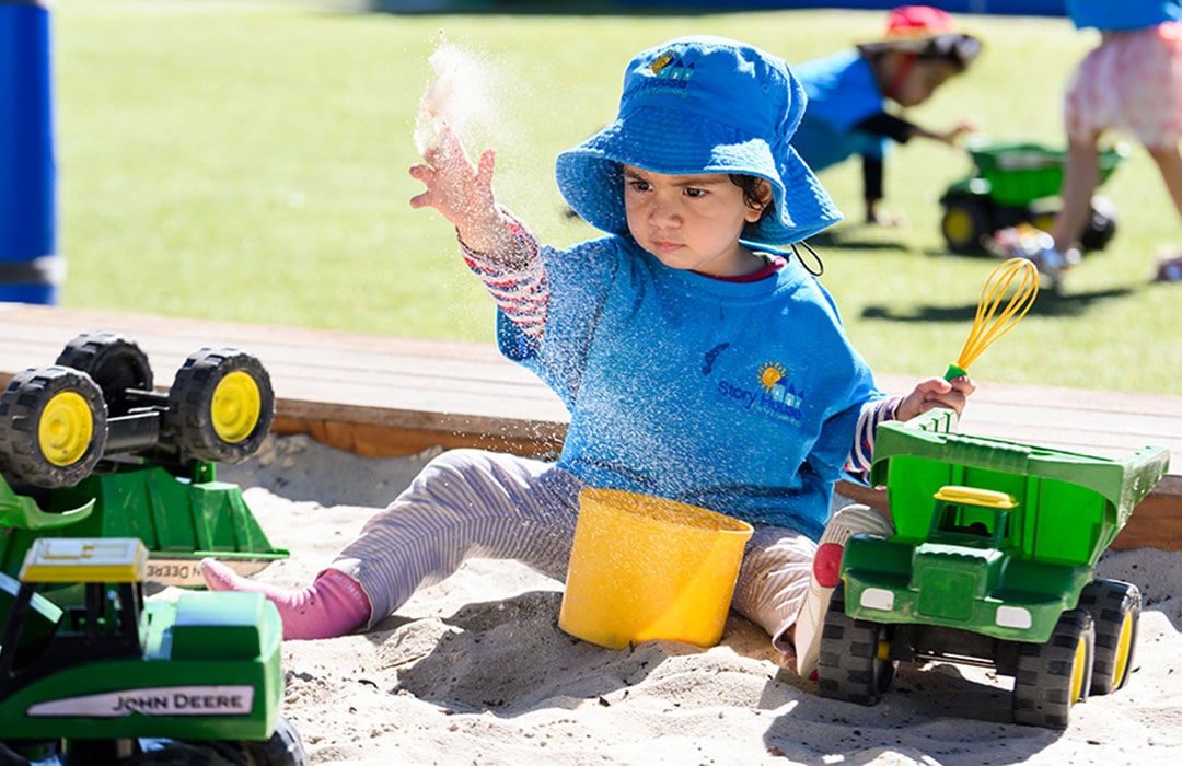 Child playing in the sand